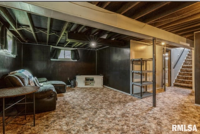 basement featuring stairs and carpet flooring