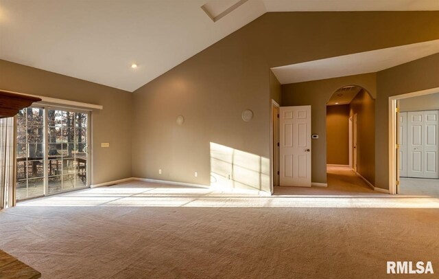 2505 Joel Dr, Herrin, IL 62948 - empty room featuring vaulted ceiling, arched walkways, carpet, and baseboards
