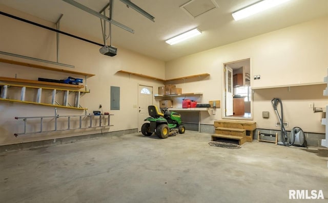 2505 Joel Dr, Herrin, IL 62948 - garage with electric panel, a garage door opener, and a workshop area