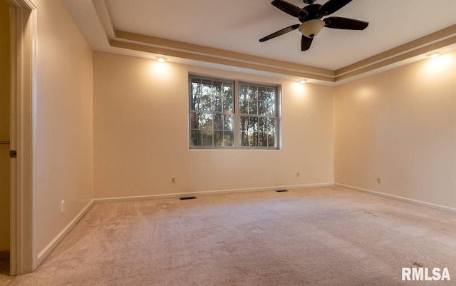 2505 Joel Dr, Herrin, IL 62948 - carpeted spare room with baseboards, a raised ceiling, and ceiling fan