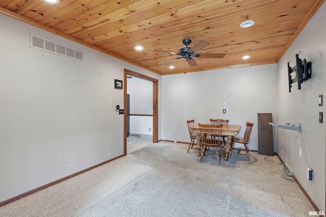 carpeted dining room with wood ceiling, recessed lighting, a ceiling fan, crown molding, and baseboards
