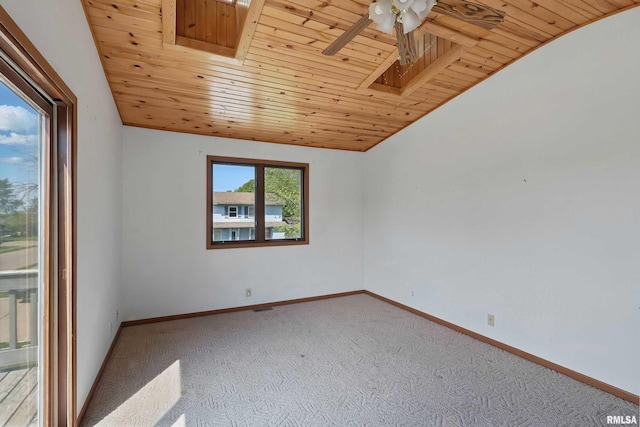 empty room with wood ceiling, carpet, a ceiling fan, vaulted ceiling, and baseboards