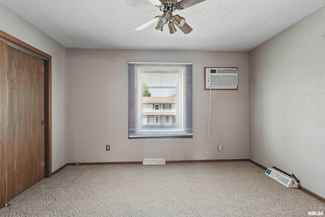 unfurnished bedroom with carpet floors, a closet, baseboards, a ceiling fan, and a textured ceiling