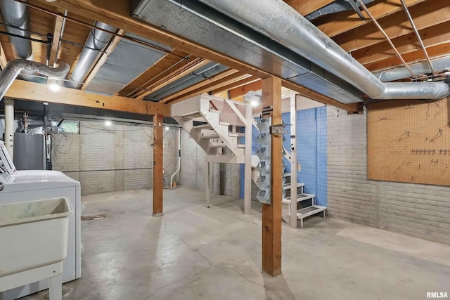 unfinished basement featuring stairway, a sink, brick wall, and gas water heater