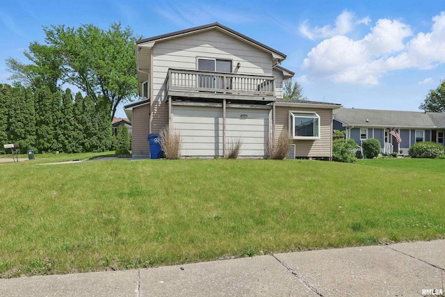 view of front of house with a balcony and a front yard