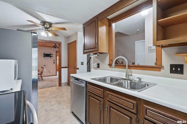 kitchen featuring a sink, dishwasher, a ceiling fan, light countertops, and open shelves