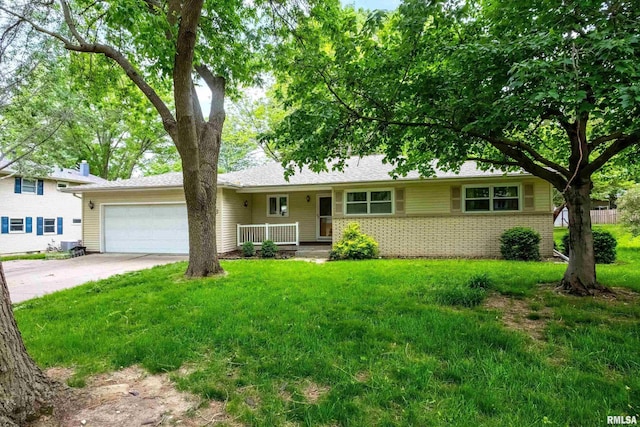 3816 Woodland Ct, Davenport, IA 52807 - single story home with an attached garage, concrete driveway, a front lawn, and brick siding