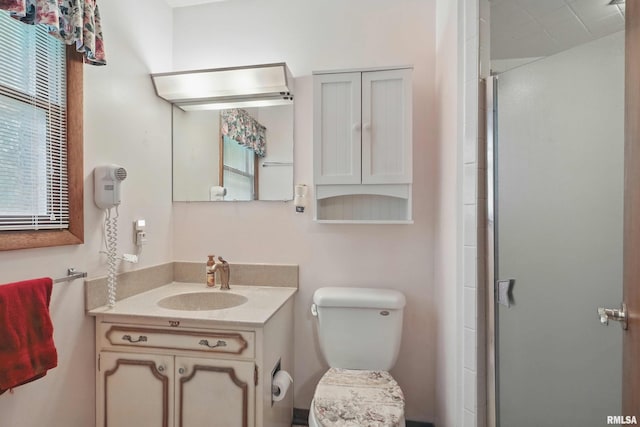 3816 Woodland Ct, Davenport, IA 52807 - full bath featuring a shower stall, vanity, and toilet