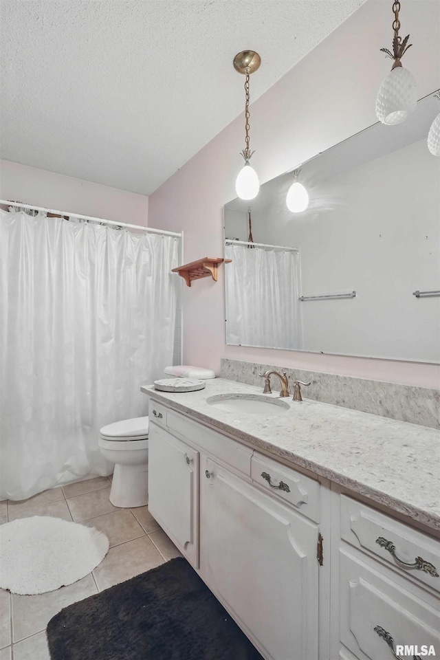 3816 Woodland Ct, Davenport, IA 52807 - full bath with tile patterned floors, vanity, toilet, a textured ceiling, and a shower with curtain