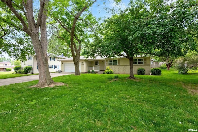 3816 Woodland Ct, Davenport, IA 52807 - single story home featuring concrete driveway, an attached garage, a front lawn, and brick siding