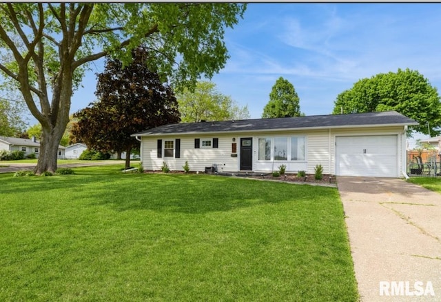 single story home with a garage, driveway, and a front yard