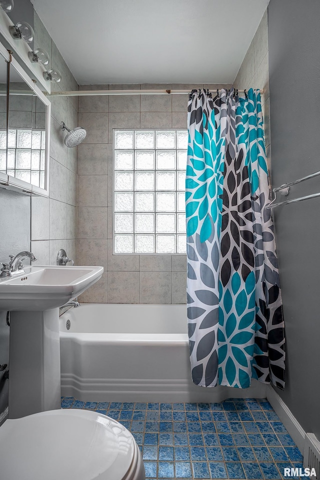 full bathroom with tile patterned flooring, shower / tub combo with curtain, and plenty of natural light