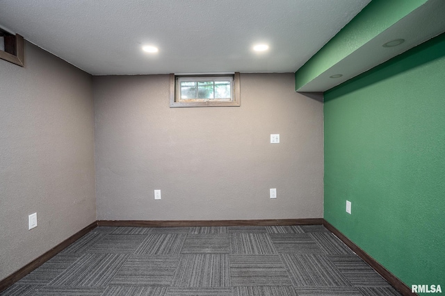 basement featuring recessed lighting and baseboards