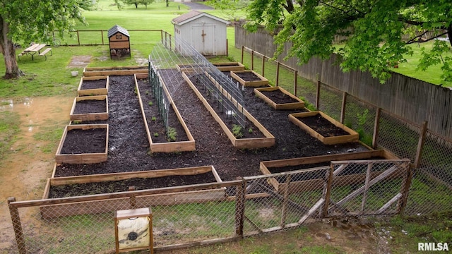 6443 Roberts Rd, Marion, IL 62959 - view of playground featuring a storage unit, a garden, and an outbuilding