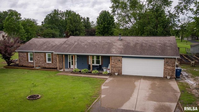 6443 Roberts Rd, Marion, IL 62959 - single story home with driveway, brick siding, a porch, and a shingled roof