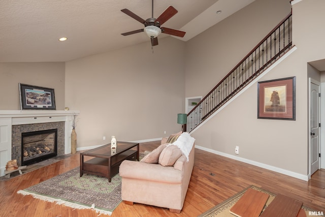9932 123rd St, Davenport, IA 52804 - living area featuring a ceiling fan, a fireplace, wood finished floors, high vaulted ceiling, and recessed lighting