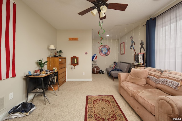 9932 123rd St, Davenport, IA 52804 - living room featuring carpet flooring, ceiling fan, and baseboards