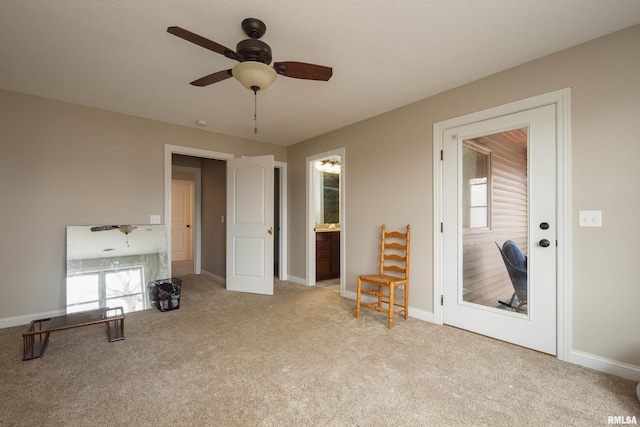 9932 123rd St, Davenport, IA 52804 - sitting room with carpet, a ceiling fan, and baseboards