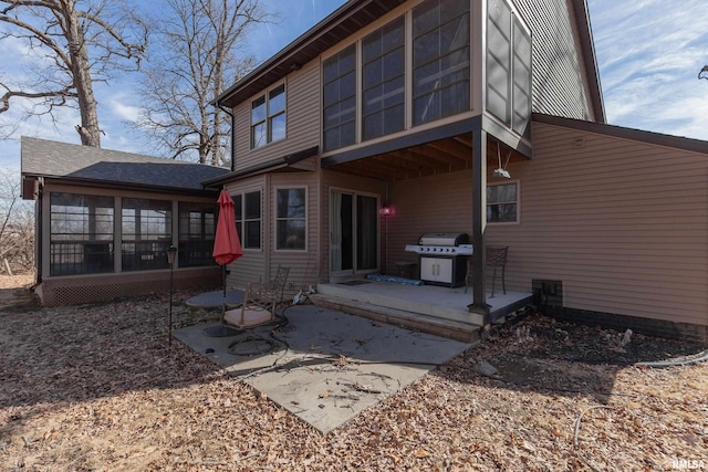 9932 123rd St, Davenport, IA 52804 - back of house with a sunroom and a patio