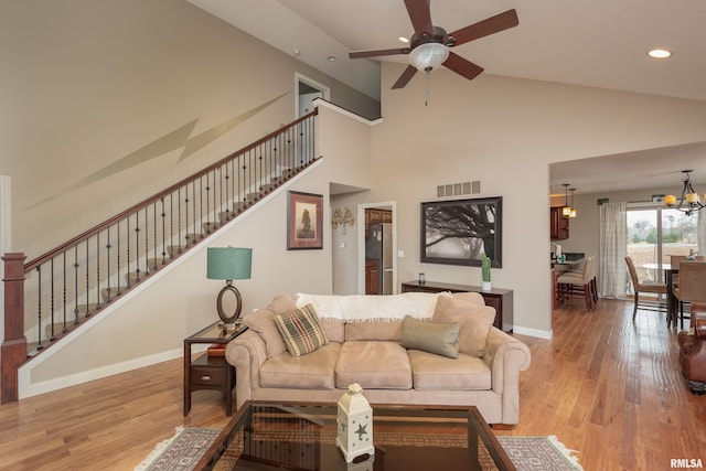 9932 123rd St, Davenport, IA 52804 - living room featuring stairway, a ceiling fan, baseboards, high vaulted ceiling, and recessed lighting