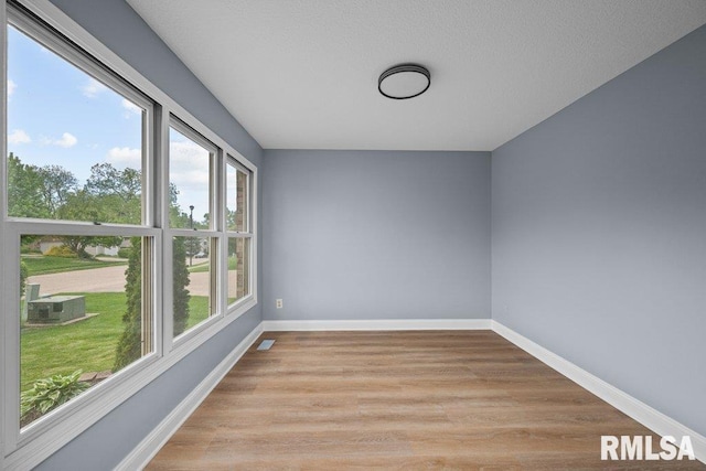 3217 Arlington Cir, Davenport, IA 52803 - spare room featuring light wood-type flooring and baseboards