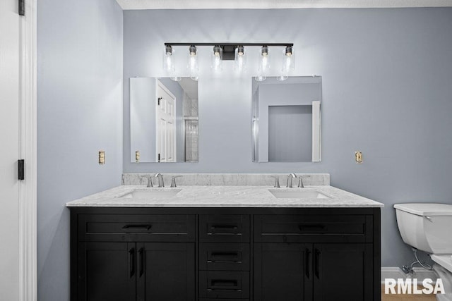 3217 Arlington Cir, Davenport, IA 52803 - bathroom with toilet and double vanity