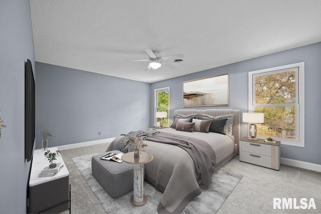 3217 Arlington Cir, Davenport, IA 52803 - bedroom featuring a textured ceiling, light colored carpet, baseboards, and a ceiling fan
