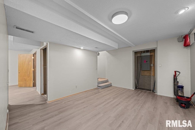 3217 Arlington Cir, Davenport, IA 52803 - finished below grade area with wood finished floors, electric panel, stairway, and a textured ceiling