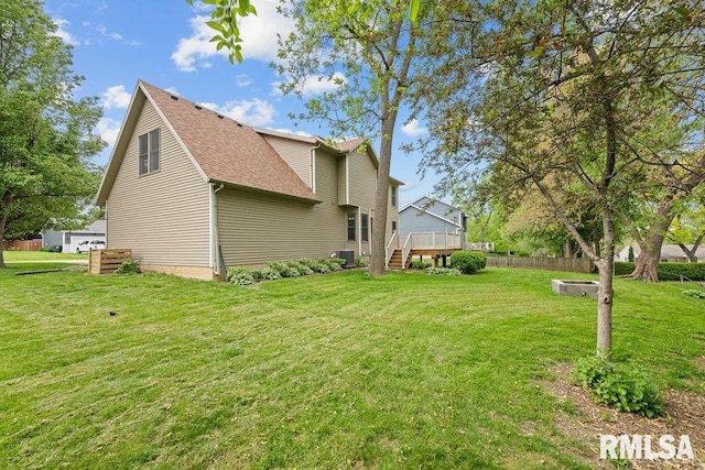 3217 Arlington Cir, Davenport, IA 52803 - view of side of home featuring a wooden deck, central AC unit, a shingled roof, and stairway