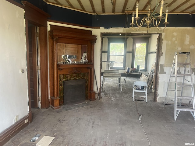 miscellaneous room featuring a chandelier and a premium fireplace