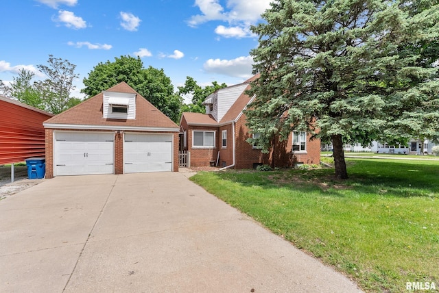 101 N Ridge St, Cambridge, IL 61238 - view of front of house featuring brick siding, a front yard, and a garage