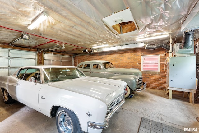 101 N Ridge St, Cambridge, IL 61238 - garage featuring a garage door opener and heating unit
