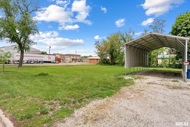 101 N Ridge St, Cambridge, IL 61238 - view of green lawn featuring a carport and driveway