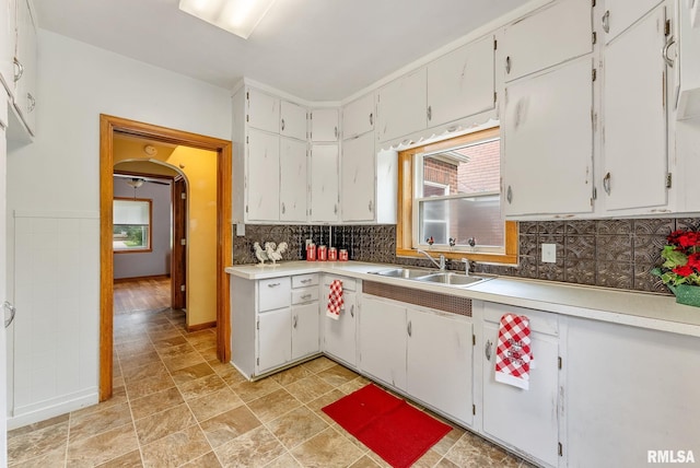 101 N Ridge St, Cambridge, IL 61238 - kitchen with a sink, arched walkways, light countertops, and white cabinets