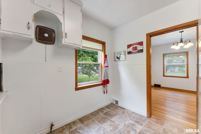 101 N Ridge St, Cambridge, IL 61238 - laundry room with a chandelier and baseboards