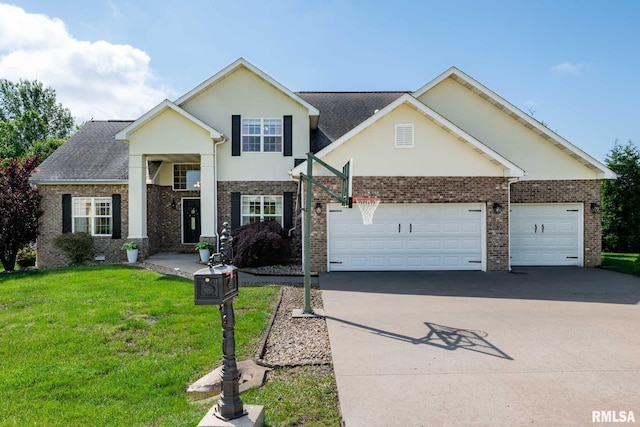 1403 Paulie Rd, Carterville, IL 62918 - view of front facade featuring driveway, a garage, stucco siding, a front lawn, and brick siding