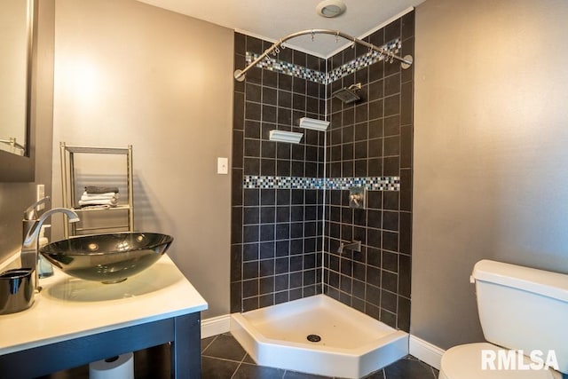 613 N 29th St, Herrin, IL 62948 - bathroom featuring a sink, toilet, a tile shower, and tile patterned flooring