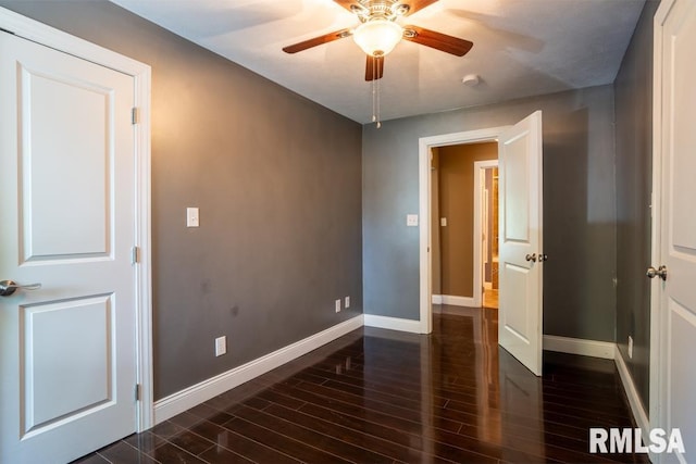 613 N 29th St, Herrin, IL 62948 - unfurnished room featuring baseboards, dark wood-style flooring, and ceiling fan