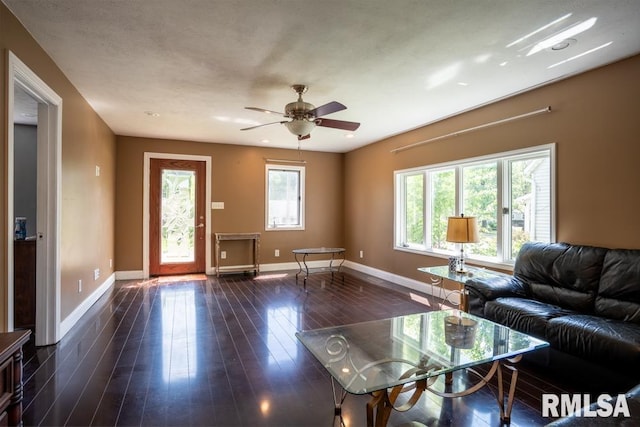 613 N 29th St, Herrin, IL 62948 - living room featuring baseboards, dark wood finished floors, and a ceiling fan