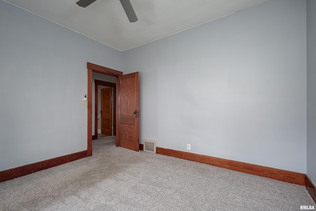 2317 Davie St, Davenport, IA 52804 - unfurnished room with carpet flooring, ceiling fan, and baseboards