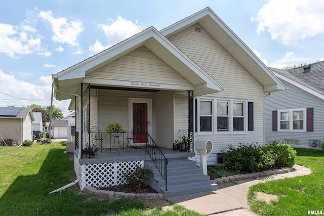 2317 Davie St, Davenport, IA 52804 - view of front of house featuring a porch and a front lawn