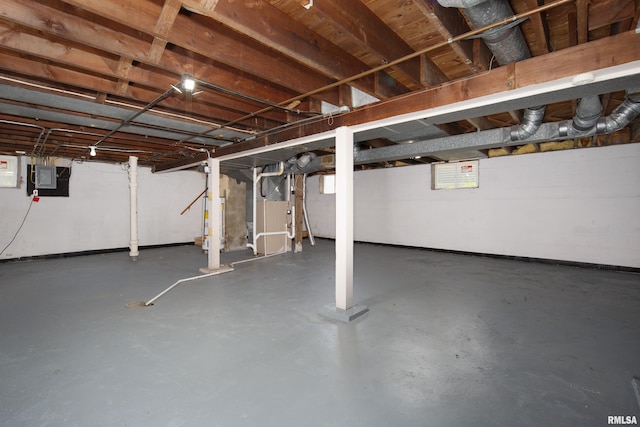 2317 Davie St, Davenport, IA 52804 - basement with electric panel, heating unit, water heater, and baseboards