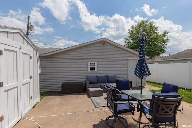 2317 Davie St, Davenport, IA 52804 - view of patio / terrace featuring an outdoor hangout area, fence, and outdoor dining space
