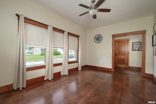 2317 Davie St, Davenport, IA 52804 - empty room with wood finished floors, baseboards, and ceiling fan