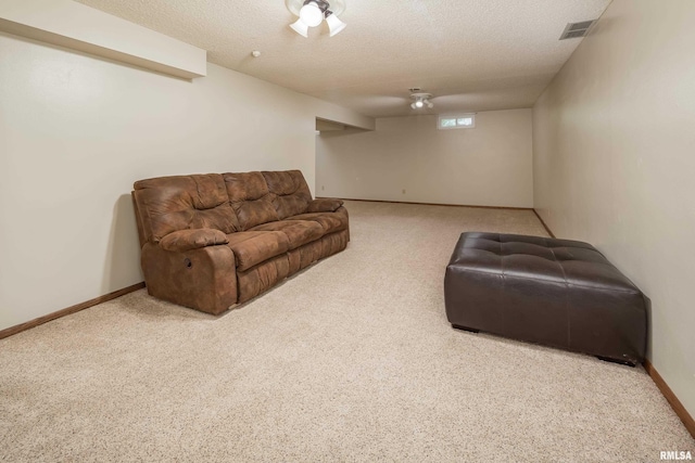 2828 Jersey Ridge Rd, Davenport, IA 52803 - living area with carpet flooring, a textured ceiling, and baseboards