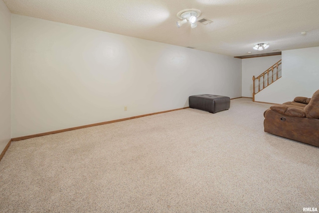 2828 Jersey Ridge Rd, Davenport, IA 52803 - unfurnished living room with carpet floors, stairs, baseboards, and a textured ceiling