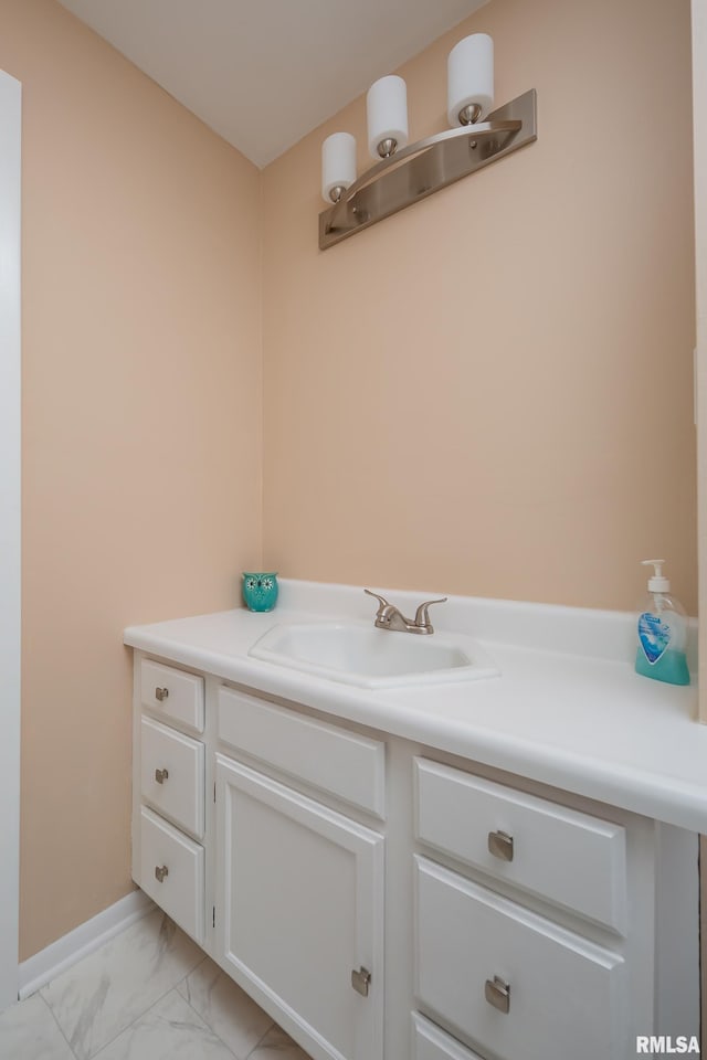 2828 Jersey Ridge Rd, Davenport, IA 52803 - bathroom with marble finish flooring, vanity, and baseboards