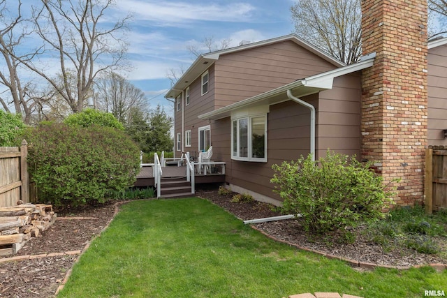2828 Jersey Ridge Rd, Davenport, IA 52803 - view of side of home with a deck and a chimney