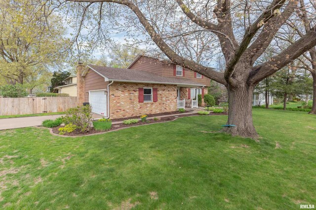 2828 Jersey Ridge Rd, Davenport, IA 52803 - traditional-style home featuring brick siding, a garage, a chimney, roof with shingles, and concrete driveway