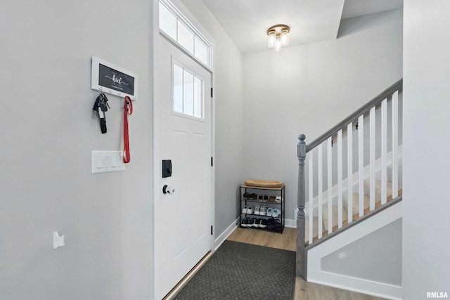 4625 W 11th St, Davenport, IA 52804 - entrance foyer with wood finished floors, stairs, and baseboards
